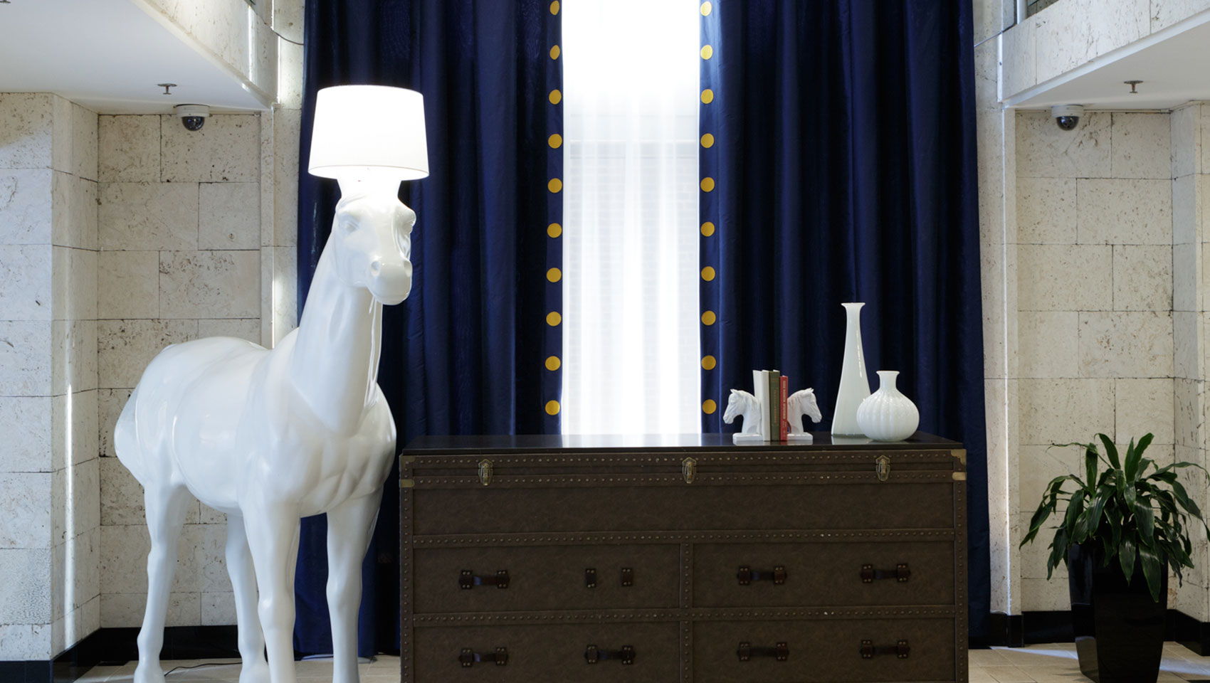 Living room and reception desk of Kimpton Hotel George