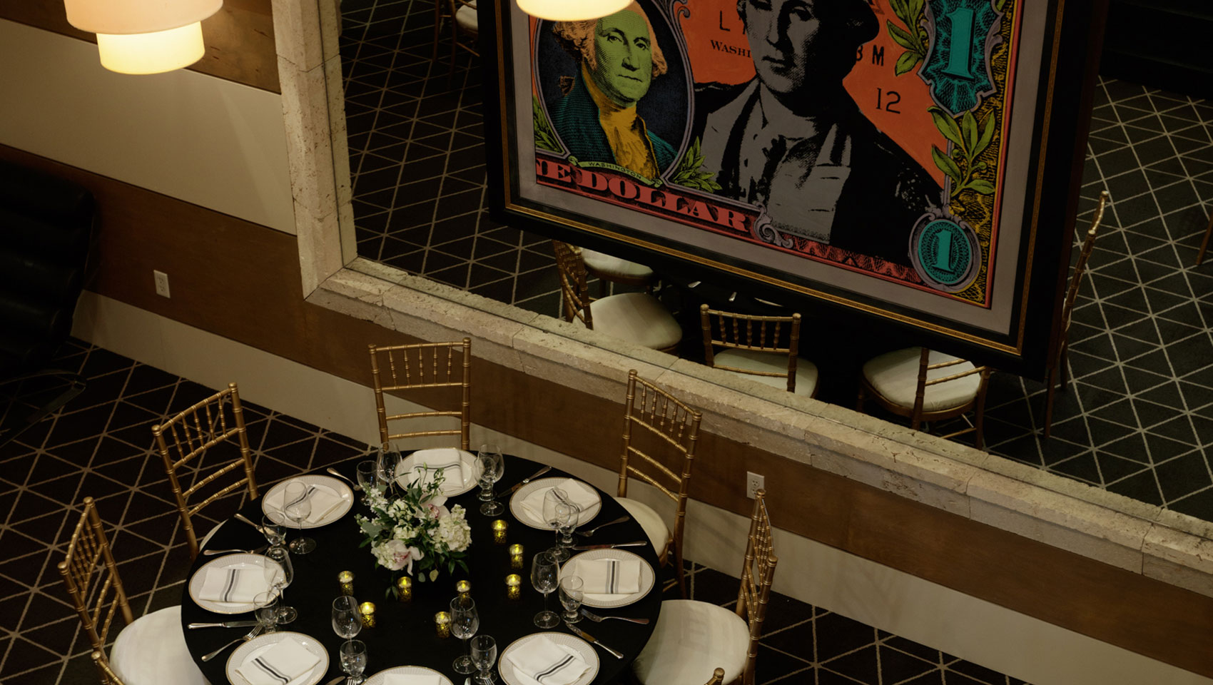 From above: a table and chairs set nicely with candles and flowers for an event at Kimpton Hotel George