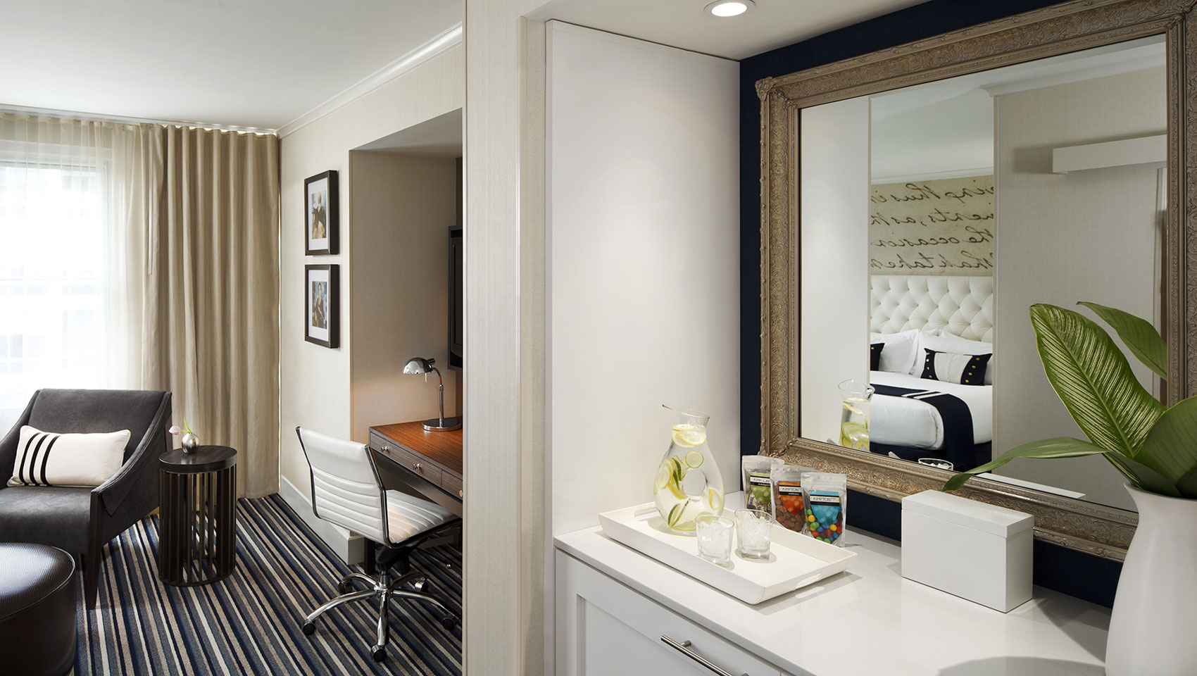 Sitting area and desk of 1 King Bed guestroom at Kimpton Hotel George