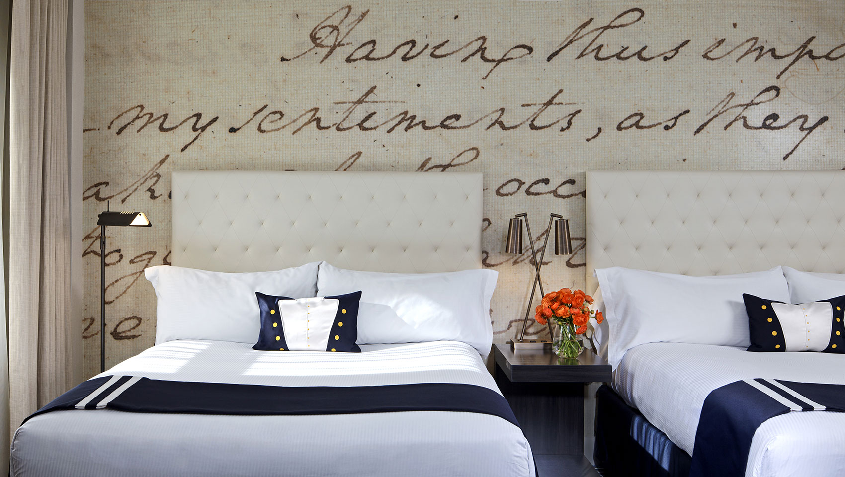 Close up of 2 queen beds with night stand at Kimpton Hotel George