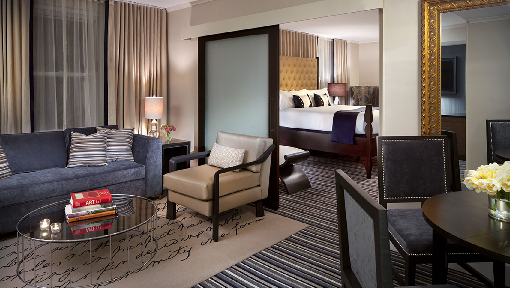 Presidential suite living area and bed at Kimpton Hotel George
